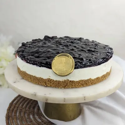Our classic Blueberry Cheesecake. We top a creamy, no-bake cheesecake layer with a sweet and tart compote made from imported blueberries, all on a crumbly biscuit base.