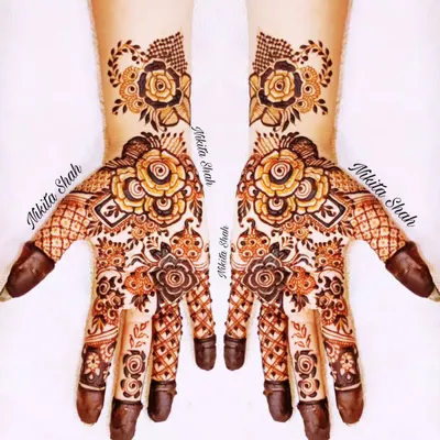 I love blending styles, and this Indo-Western design is a great example. It combines bold rose florals with delicate traditional patterns for a look that is modern, elegant, and perfect for any party or sangeet.