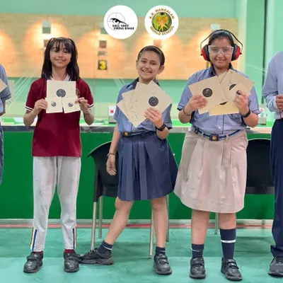 Students from K.R. Mangalam World School proudly display their targets. We help kickstart shooting careers with structured school programs.