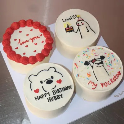 A fun and quirky set of four custom bento cakes for a birthday celebration. We included designs like a cute Winnie the Pooh, a weightlifting "rockstar" doodle, and a simple "love you" message to make it extra personal.