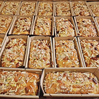 A tray full of our classic Parsi Mawa Tea Cakes, fresh out of the oven. These dry cakes are loaded with nuts and are a crowd favorite for tea time and corporate snack boxes.