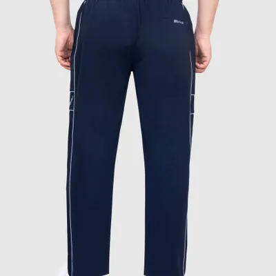A back view of a model wearing navy sportswear track pants, shot on a clean grey background. This ghost mannequin style is perfect for e-commerce listings, showing the fit and design clearly.