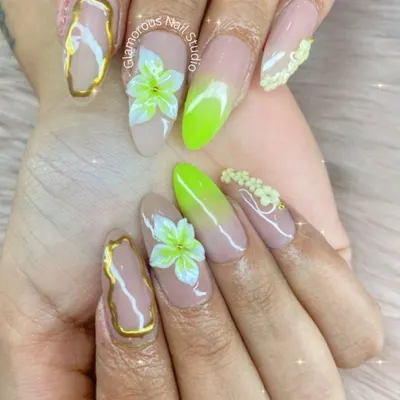 This set is a perfect example of what we love to do: combining multiple techniques to create something truly special. Here, we've blended a vibrant neon green ombré with delicate, hand-sculpted 3D flowers and elegant gold chrome details on a nude base for a look that's both bold and beautiful.