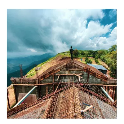 Overlooking the dramatic landscape from the roof of our Vagamon resort project during construction. This image embodies my commitment to being on-site, making critical design decisions that honor the spirit and scale of the location.