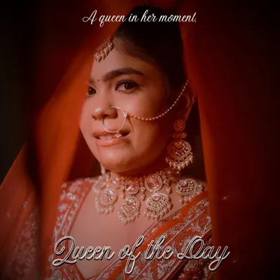 Every bride is the queen of her day. We captured this stunning close-up through her veil, focusing on her regal jewelry and confident expression, a perfect portrait of a bride ready to walk into her forever.