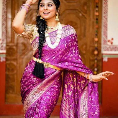 A stunning bridal makeover featuring one of our rich purple Banarasi silk sarees. The all over gold zari work and traditional accessories create a timeless look for any bride.
