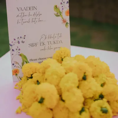 Our custom Mithai Bar, because no one can eat just one. We set up this delightful station with a variety of laddoos, barfis, and dher saara pyaar, complete with a cute sign and traditional marigold decorations.