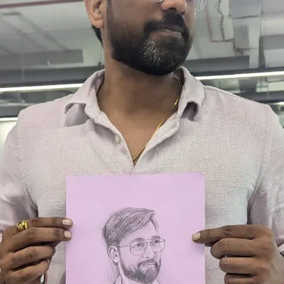 A happy client holding his freshly sketched portrait at the office. I enjoy doing these quick, live sketches to capture people in their natural environment.