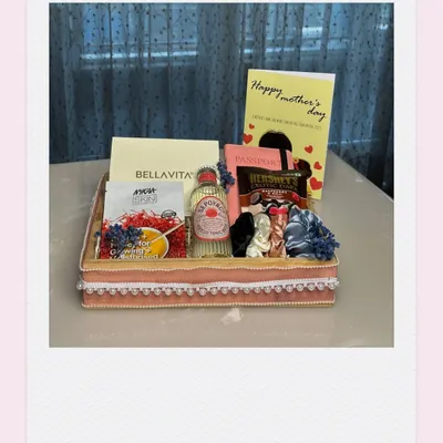 A Mother's Day hamper designed to be as elegant and graceful as she is. This one includes perfume, chocolates, and other treats in a beautifully decorated tray.