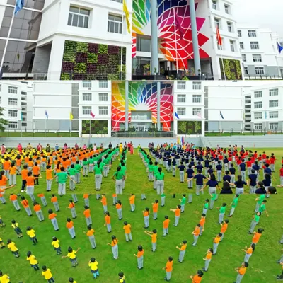 An aerial shot capturing a large-scale student event at Amrita International Vidyalayam. The vibrant colors and organized formation are captured perfectly from above, showcasing the school's community spirit.
