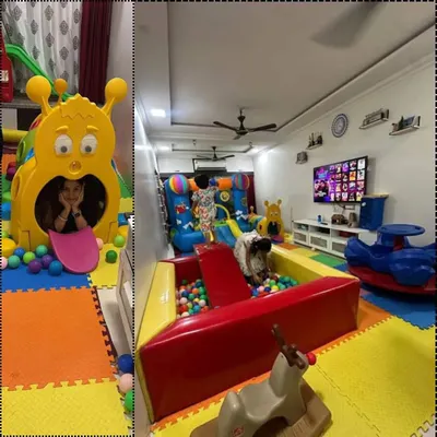 A fantastic indoor setup in a client's home. This playzone features a large ball pit, a bouncy castle with a slide, and a caterpillar tunnel, showing how I can bring a full-scale play experience right into your living room.