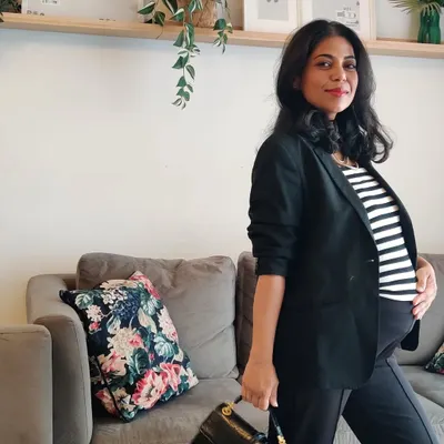 As a working mother, I understand the challenge of dressing a changing body with confidence. This is me styling my bump for a professional setting, proving that great style is possible at every stage of life.