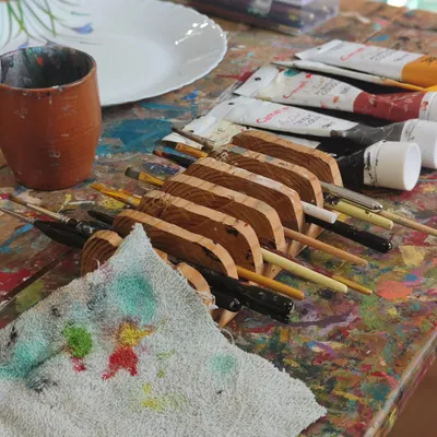 Paint-spattered tables and brushes that feel like an extension of our hands. This is our happy place, where we sit down to create and the world shifts.