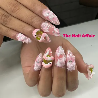 A truly unique and daring design featuring a sculpted 3D snake on a pink base, with water droplet effects and rhinestone accents. This shows the level of custom artistry I can achieve.