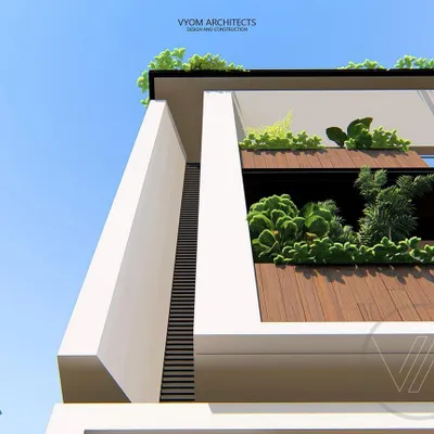 A detail shot of the Dasharatha residence, highlighting the integration of green planters into the balcony design. This adds a touch of nature and softness to the modern architectural lines.