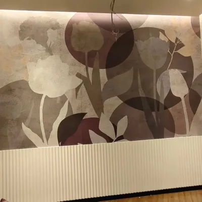 A modern, large-scale floral mural installed above white wainscoting in Palghar. The abstract tulips and moody color palette create a sophisticated and artistic look.