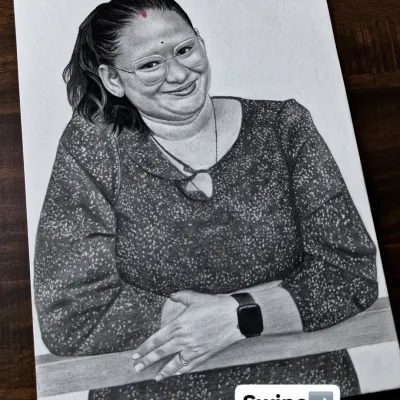 A commissioned portrait of a woman with a warm, happy smile. My aim is always to capture the genuine emotion that makes each person's portrait special and personal.