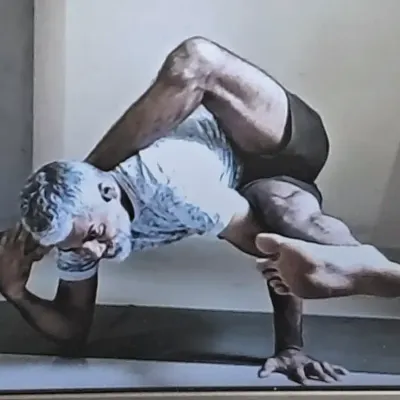 This is Purna Ardha Matsyendrasana, an advanced twisting and arm-balancing pose that demands significant flexibility and strength. My practice is a testament to the dedication I bring to teaching these complex asanas.
