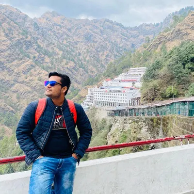 A photo from my trek to the Shri Mata Vaishno Devi shrine. The temple complex, seen in the background, is a testament to faith and continuous development for the comfort of pilgrims.
