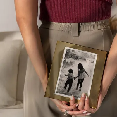 Some memories deserve more than just a place in your heart. I designed this simple, elegant brass photo frame to give your treasured moments the showcase they deserve.