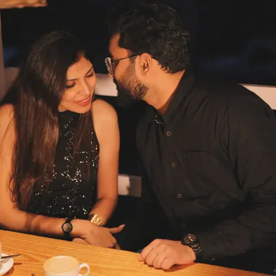 Lost in conversation during a date night. This photo captures the natural chemistry and intimacy of a couple sharing a quiet moment, away from any grand setup.