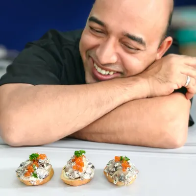 Pure joy is watching your creation come to life. My smile says it all as I admire the indulgent truffle mushroom crostini. Culinary passion served with happiness.