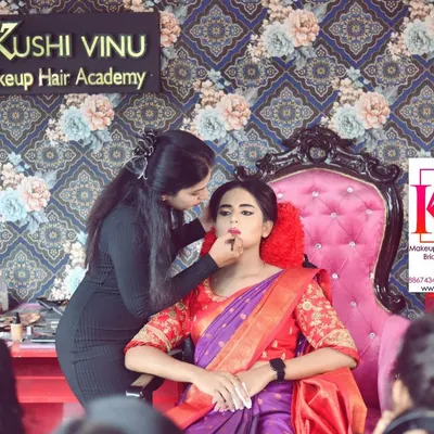 Here I am doing a live makeup demonstration for my students. I explain every step of the process, from skin preparation to the final lipstick application, so they understand the 'why' behind every technique.