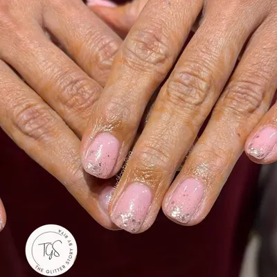 This is how a nail growth journey can begin. A simple, clean gel overlay on shorter nails provides the strength and protection they need to start growing out. The subtle glitter adds a nice touch.