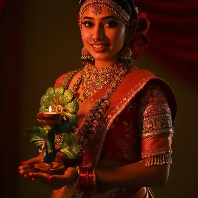 Wishing everyone a happy Diwali with this beautiful look. The model is wearing a stunning matha patti and choker set, perfect for the festival of lights.