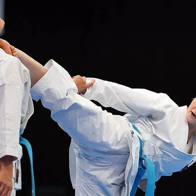 This is what our training leads to. A high kick delivered with precision and power, showing how flexibility and strength come together in a real-world karate technique. I train you to be strong and capable.