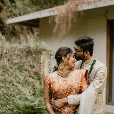 A tender moment captured in a lush, natural setting. We find those perfect, quiet spots at your venue for romantic portraits away from the crowds.