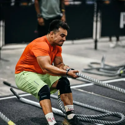 The sled pull is a beast. Here I am at Hyrox Mumbai, focusing on technique to move 153kgs efficiently. It's all about using your body weight and maintaining a strong posture.