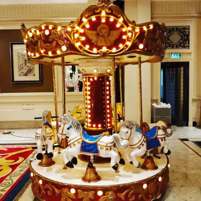 Our Red and Gold carousel is another beautiful option for your event. Here it is set up indoors, showing its versatility for transforming hotel ballrooms and event halls.