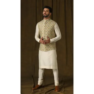 The Lemon Bandi & Ivory Kurta Ensemble. The vibrant lemon vest features intricate floral embroidery, creating a playful and charming look perfect for a daytime celebration.