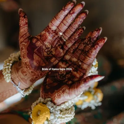 The beauty of a developed stain. This photo shows the deep, rich color of the mehendi on the bride's palms, complemented by her beautiful floral jewelry during the haldi ceremony.