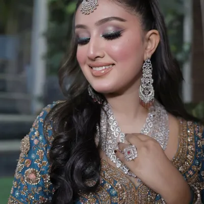 Glowing up with a fresh glam makeup look. This features a stunning silver-blue smokey eye, flawless skin, and a glossy nude lip for a high-impact, glamorous result.