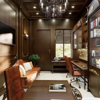 A view of a classical home office we designed, showcasing rich wood-paneled walls and a coffered ceiling. We created a sophisticated and inspiring workspace with custom bookshelves, elegant furniture, and warm, focused lighting. This is a perfect example of how classical design can be both beautiful and functional.