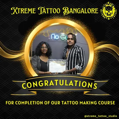 Here is one of our recent graduates holding her course completion certificate. We celebrate every student who puts in the hard work to become a professional tattoo artist.