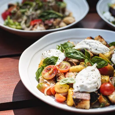 Our seasonal Mango Tuscan Salad is back. We pair sweet chunks of fresh mango with our creamy burrata, juicy cherry tomatoes, and toasted sourdough croutons.