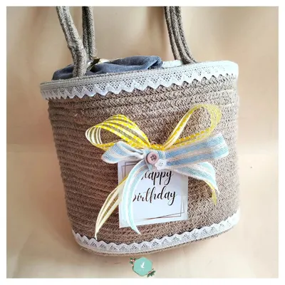 A birthday hamper for a six-year-old, beautifully packed in a reusable jute basket with a colorful ribbon. The presentation is just as important as the surprises inside.