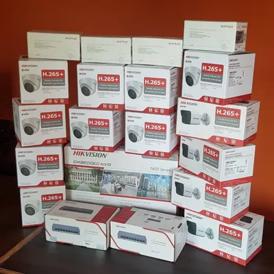 A complete kit ready for a large IP camera installation. This includes multiple Hikvision turret and bullet cameras, an embedded NVR, and PoE network switches.