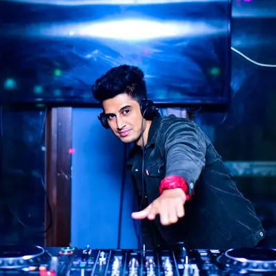 In the zone at Hangover, getting ready to drop the next track. I'm always focused on the mix and the reaction from the dance floor.