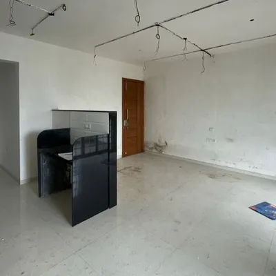 Before: A bare room with exposed wiring. We saw the potential for a vibrant, modern living space.
