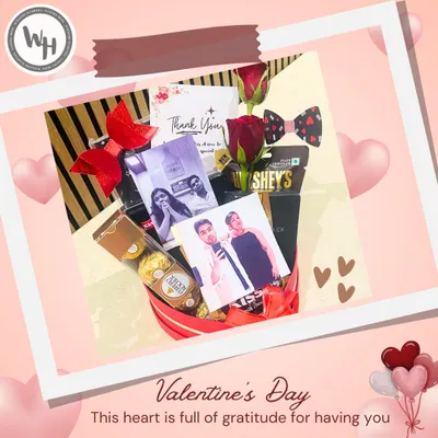 This Valentine's Day hamper is full of gratitude and love. It features personal photos, Ferrero Rocher chocolates, and Hershey's Kisses, all arranged in a beautiful heart-themed box.