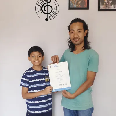 A huge congratulations to Revanth for passing his RSL Entry Level acoustic guitar exam with Distinction. We're so proud to see his hard work and talent recognized.