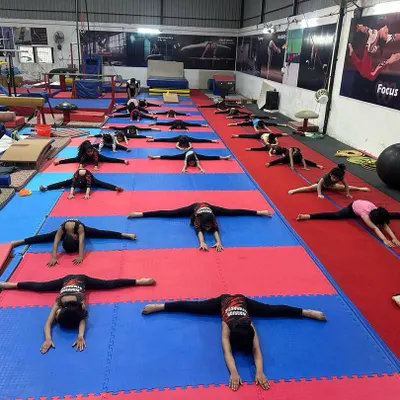 This is where champions are made, on the mats, building flexibility one stretch at a time. Here my students are working on their middle splits, a fundamental requirement for all artistic gymnastics events.