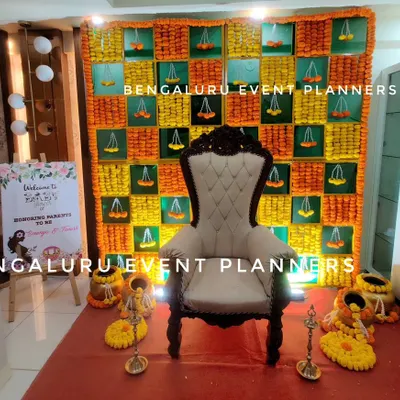For this traditional baby shower, I created a complete setup including a beautiful marigold backdrop, a comfortable throne for the mother-to-be, and a personalized welcome sign. This arrangement honors cultural traditions while ensuring a celebratory atmosphere.