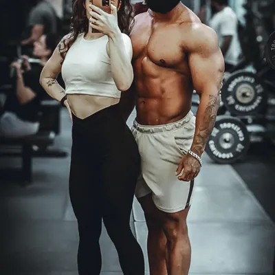 With my partner, who is also my training partner. We support each other's goals both in and out of the gym.