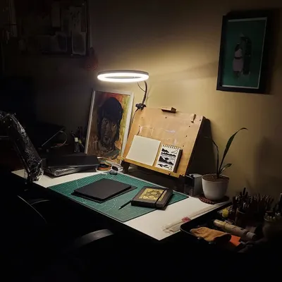 This is my creative space. It's a simple setup with my drawing board, sketchbooks, and tools. This is where I spend my nights working, thinking, and getting lost in the process of making art.