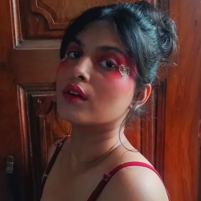 This makeup look is all about bold, romantic expression. I used a heavy red blush and created a heart shape with tiny rhinestones for a dramatic, love-themed look.
